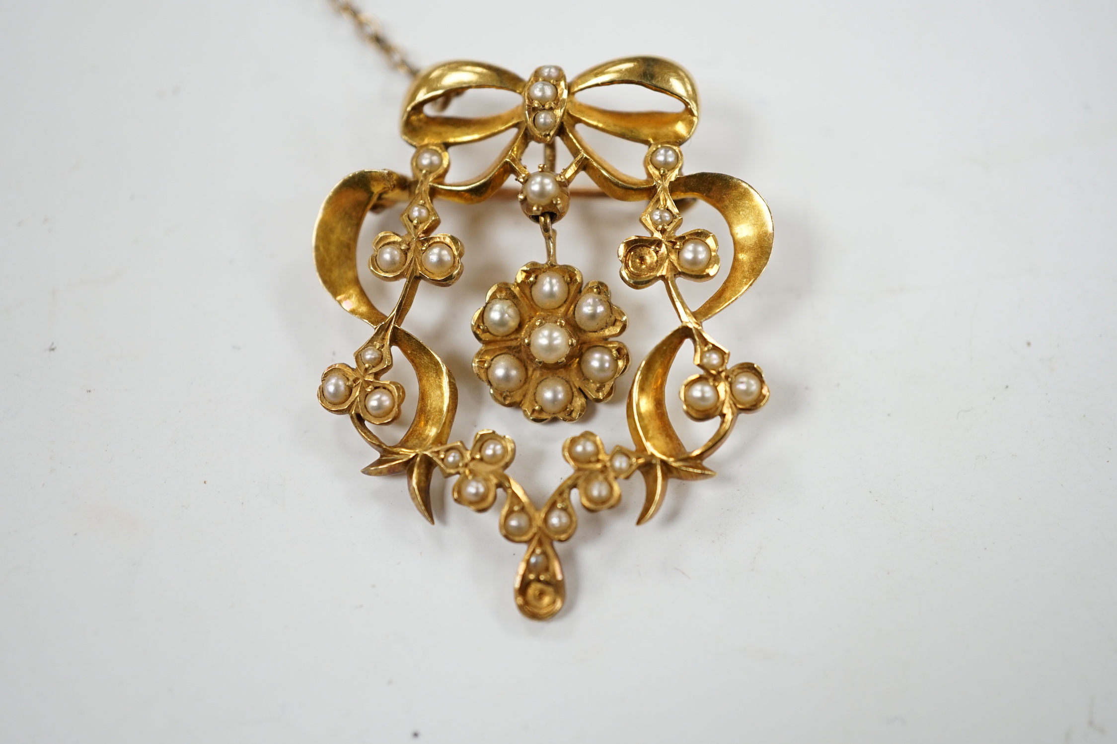 An Edwardian 15ct and seed pearl cluster set drop brooch, 37mm, gross weight 8 grams.